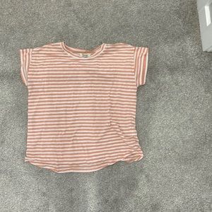 Coral and white t-shirt ready to be in another home